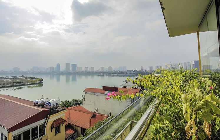 Overlooking West Lake from above at this stunning 3-bedroom apartment rental in To Ngoc Van str